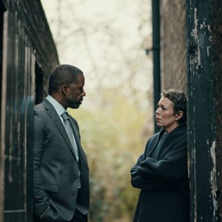 Adrian Lester and Olivia Colman looking at eachother